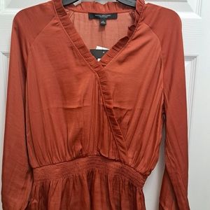Beautiful silk blouse ready to be paired with your choice of skirt or pants.